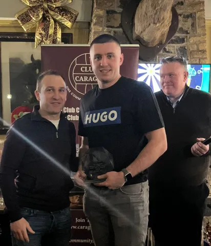 Dan Lynam being presented with POTY Award